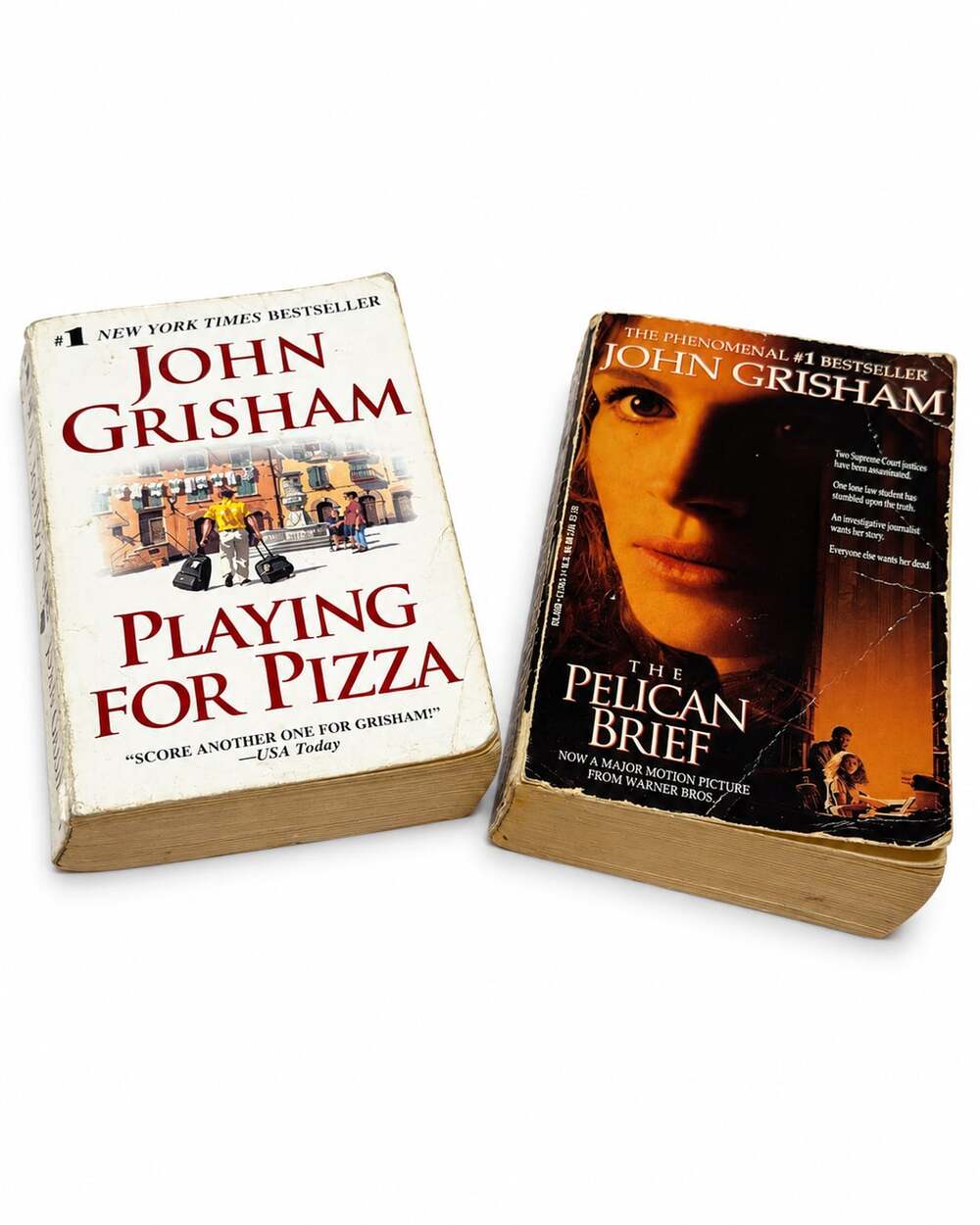 Set of 2 paperback novels by bestselling author John Grisham.